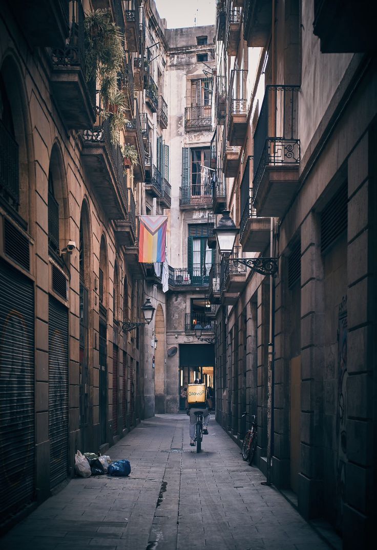 a narrow alleyway in an old european city