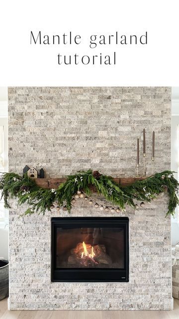 the fireplace is decorated for christmas with greenery on top and mantles above it