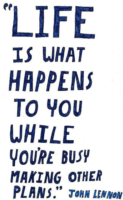 a blue and white poster with the words life is what happens to you while you're busy making other plans