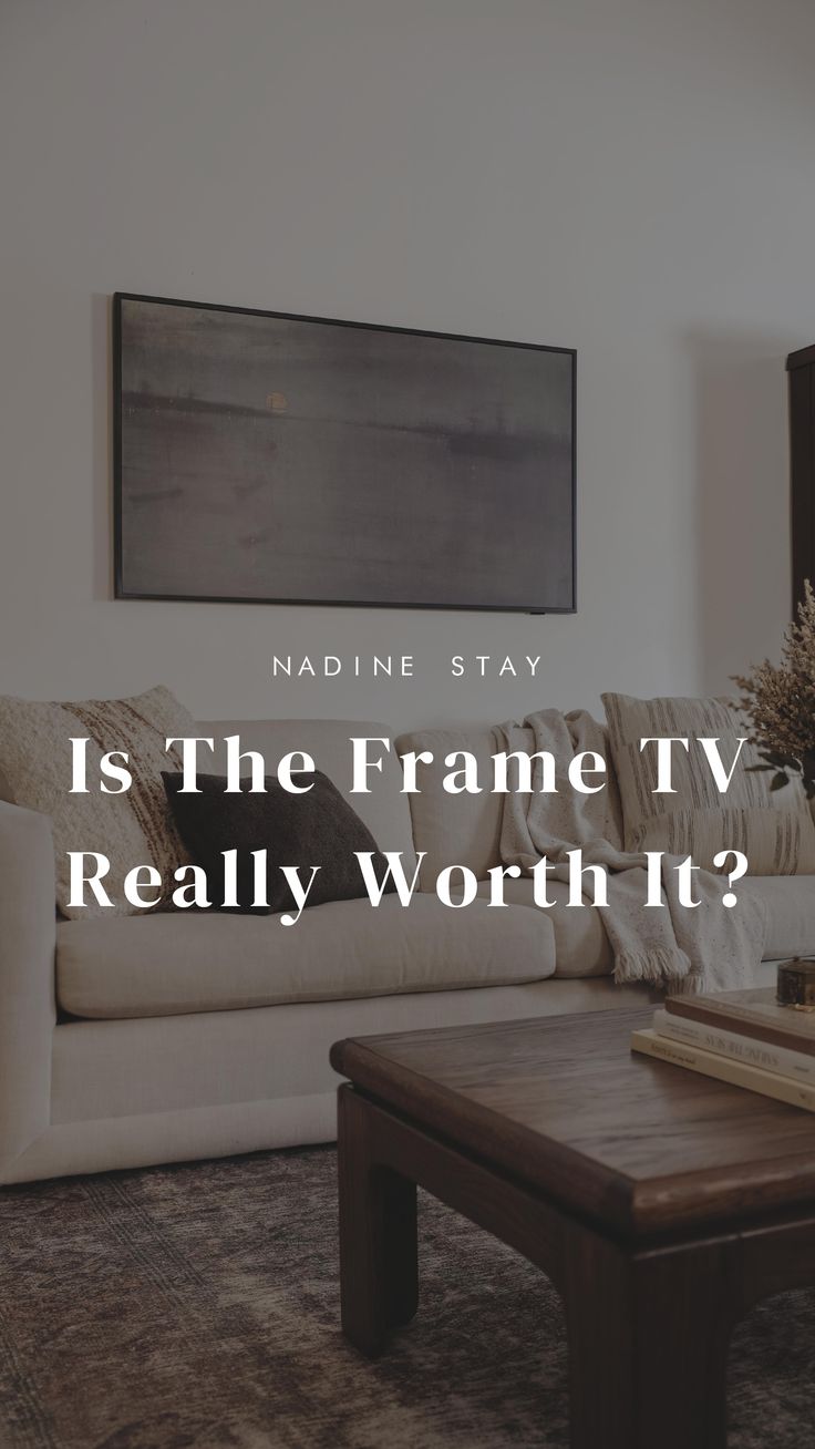 a living room filled with furniture and a large painting on the wall above it that says, is the frame tv really worth?