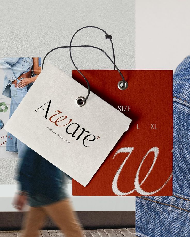 a woman walking past a store sign and jeans