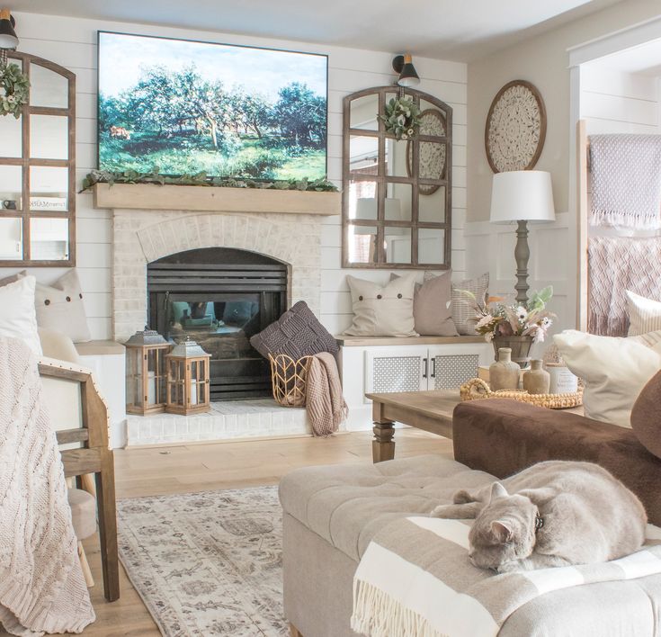 a living room filled with furniture and a fire place in front of a painting on the wall