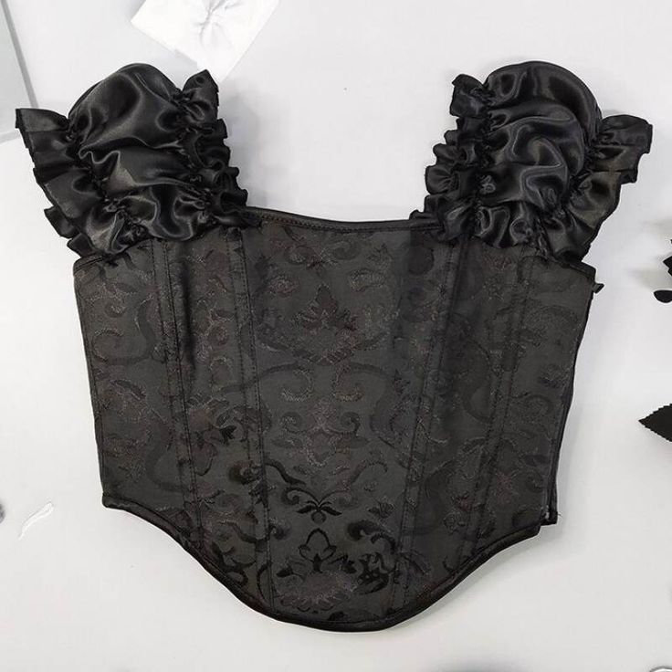 Opt for a style all in finesse with this steampunk embroidery corset. Ideal for a simple and sophisticated look. Type: Steampunk corset Materials : 90% Polyester, 10% spandex Decoration: embroidery Check your measurements, if you are between two sizes, take the larger one. Satin Overbust Corset With Ruffles, Gothic Underbust Corset For Party, Black Fitted Corset For Halloween, Fitted Gothic Corset Dress For Night Out, Elegant Fitted Halloween Corset Dress, Black Satin Overbust Corset, Elegant Fitted Corset Dress For Halloween, Steampunk Overbust Corset For Party, Black Underbust Corset With Ruffles