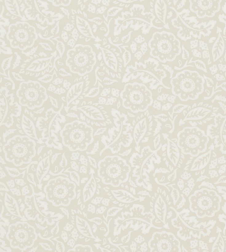 the back side of a white wallpaper with an ornate design on it, and text that