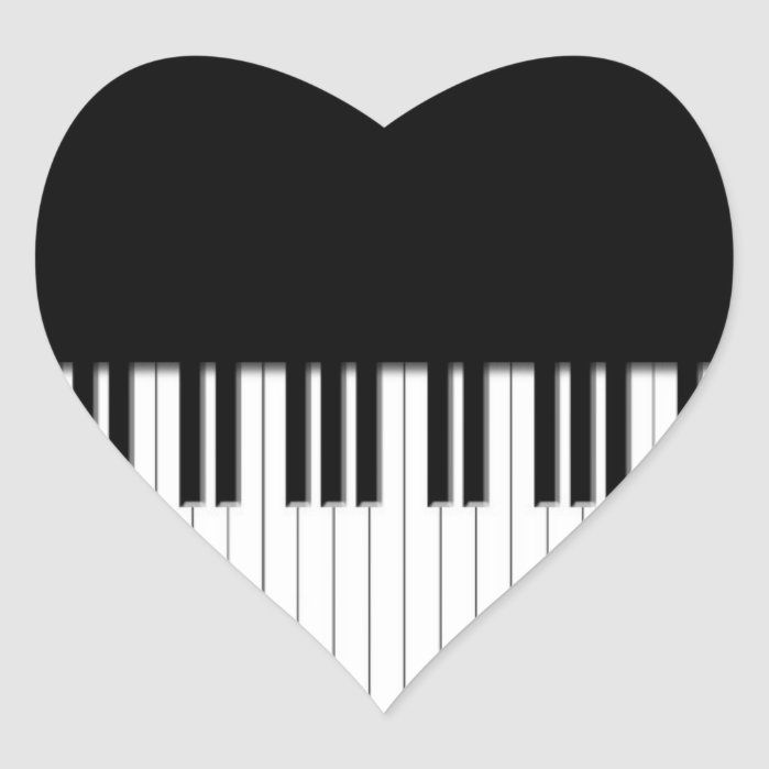 a heart shaped sticker with piano keys in the shape of a black and white piano