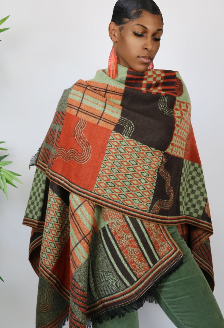 This gorgeous shawl is all about color. It features a beautiful ethnic inspired motif and features beautifully shades of green, orange and brown. One Size Fits All Multicolor Shawl Scarves For Fall, Orange Shawl Scarf For Fall, Orange Shawl Scarves For Fall, Bohemian Multicolor Wrap For Fall, Bohemian Multicolor Wraps For Fall, Bohemian Multicolor Fall Wraps, Brown Shawl Dupatta With Traditional Patterns, Green Bohemian Pashmina Shawl, Multicolor Shawl Wrap For Fall