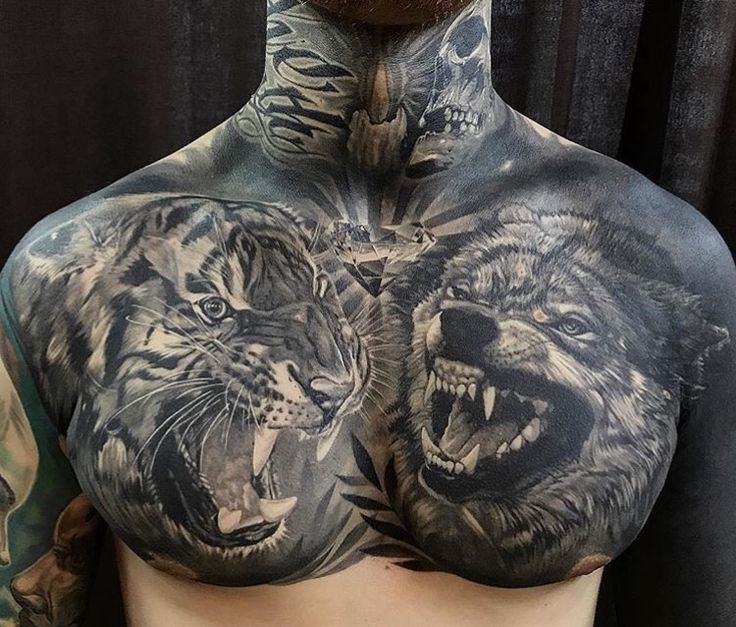 a man's chest with two lions on it