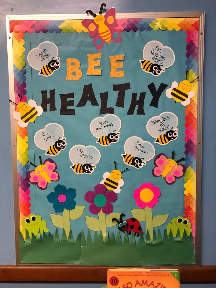 a bulletin board with bees and flowers on it that says bee healthy in front of a blue background