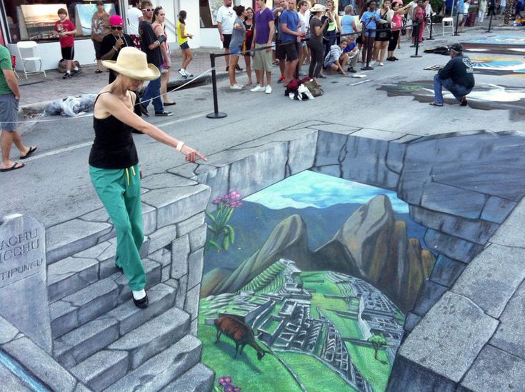 a woman is standing on some steps with her hand in the air and painting it