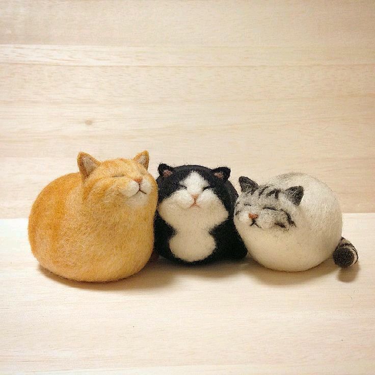 three small stuffed animals sitting next to each other