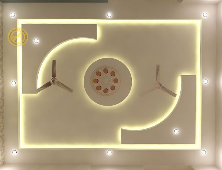 an overhead view of a ceiling with lights and clocks on the wall in front of it