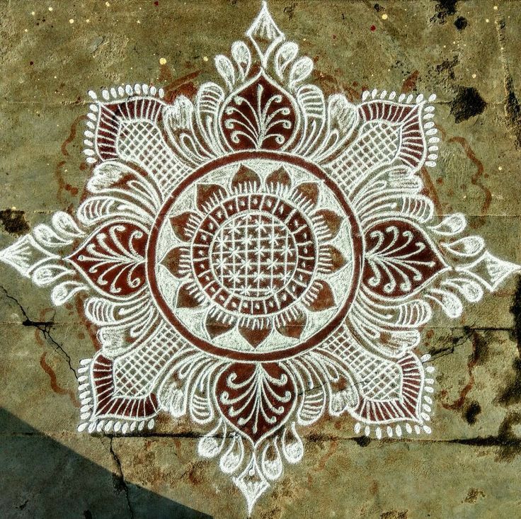 an intricately designed piece of art on the ground