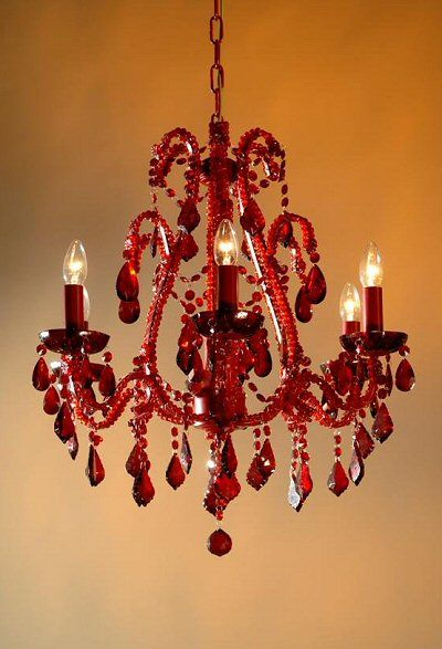 a red chandelier hanging from a ceiling