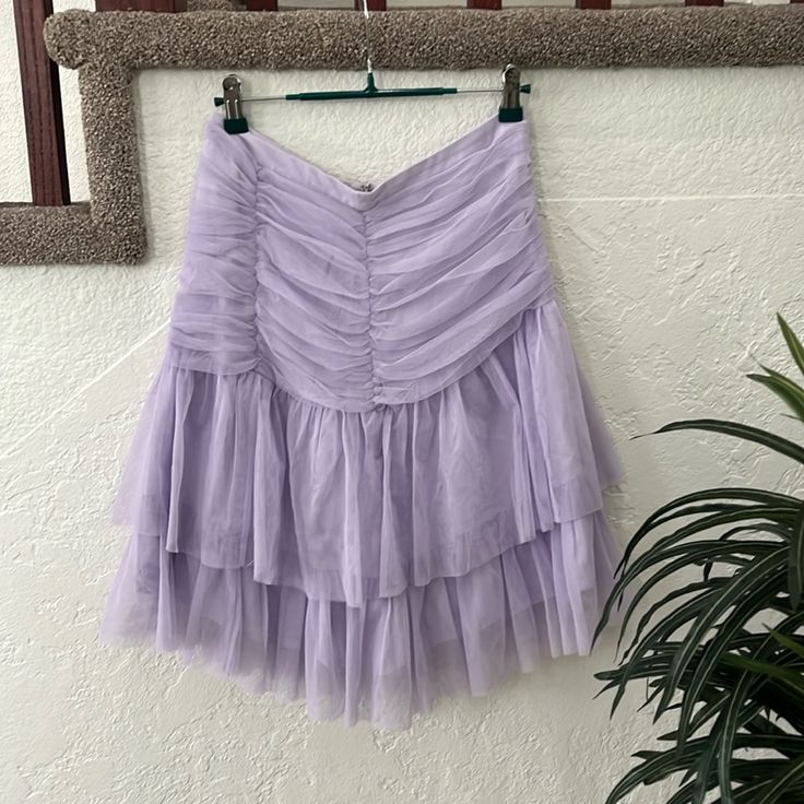 New With Tag Beautiful Lilac Color Tulle Layered Skirt With Lining Please See Pictures With Measurements Check Out The Video For A Closer Look! Tiered Pleated Skirt For Cocktail, Cocktail Tiered Pleated Skirt, Tiered Tulle Skirt For Cocktail, Cocktail Skirt With Ruffled Flowy Design, Tiered Mini Skirt For Summer Evenings, Cocktail Flowy Ruffled Skirt, Spring Evening Tiered Pleated Skirt, Tiered Skirt For Evening In Spring, Tiered Tulle Cocktail Skirt