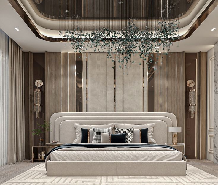 a large bed sitting under a chandelier in a bedroom