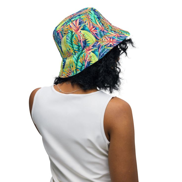 Inspired by the vibrant beauty of Hawaiian tropical foliage, our Hawaiian Tropical Leaves Bucket Hat brings the essence of the islands right to your wardrobe. Crafted with care and attention to detail, this hat captures the spirit of aloha and invites you to embrace the laid-back tropical vibe. This reversible bucket hat can be worn on both sides, making it easy to match with different outfits. Made of breathable premium fabric, this hat will become your go-to streetwear accessory. • Made to ord Adjustable Bucket Hat For Vacation, Multicolor Summer Bucket Hat With Upf 50+, Reversible Short Brim Bucket Hat For Vacation, Tropical Multicolor Spring Hats, One Size Bucket Hat For Vacation, Casual Reversible Hat For Vacation, Multicolor Bucket Hat With Upf 50+, Multicolor Upf 50+ Bucket Hat, Multicolor Reversible Summer Sun Hat