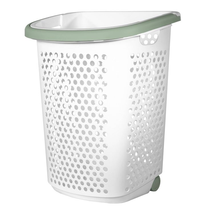 Tilt & Roll, Lift & Go! This rolling hamper from Home Logic is an ideal solution to easily transport your laundry. The large capacity hamper can hold loads of clothes for your convenience. Comfortably travel throughout your home or across the hallway to a shared laundry room with this rolling hamper. It can also help you maneuver around a laundromat. Put less effort into your laundry routine with this rolling hamper that doubles as a mobile laundry basket. Hamper With Wheels, Laundry Station, Laundry Hamper With Wheels, Basket With Wheels, Wicker Laundry Hamper, Laundry Hamper With Lid, Laundry Hampers, Natural Laundry, Hamper Storage