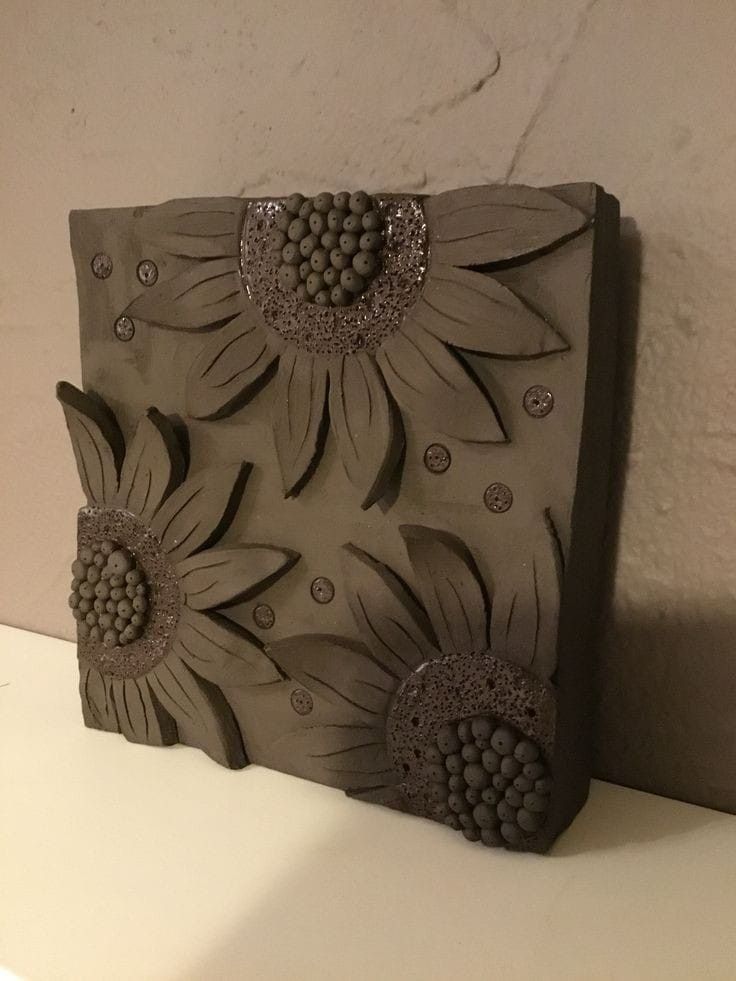 this is an image of a ceramic block with flowers on it