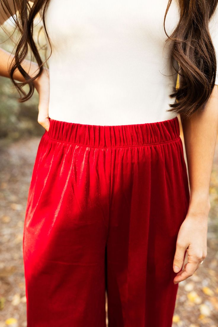 the perfect start to a fun, luxe outfit- these pants are a must have for all your holiday and valentine events! elastic waist, wide leg, in the prettiest red velvet. model is wearing a size small. size small measurements: waist- 25", inseam- 31" size 1X measurements: waist- 33" inseam- 30" Casual Red Bottoms For Holidays, Casual Red Holiday Bottoms, Red Wide Leg Pants With Elastic Waistband, Red Long Pants For Holiday, Red Stretch Wide Leg Pants With Elastic Waistband, Holiday Red Long Pants, Red Holiday Long Pants, Red Wide-leg Pants With Elastic Waistband, Holiday Stretch Wide Leg Bottoms