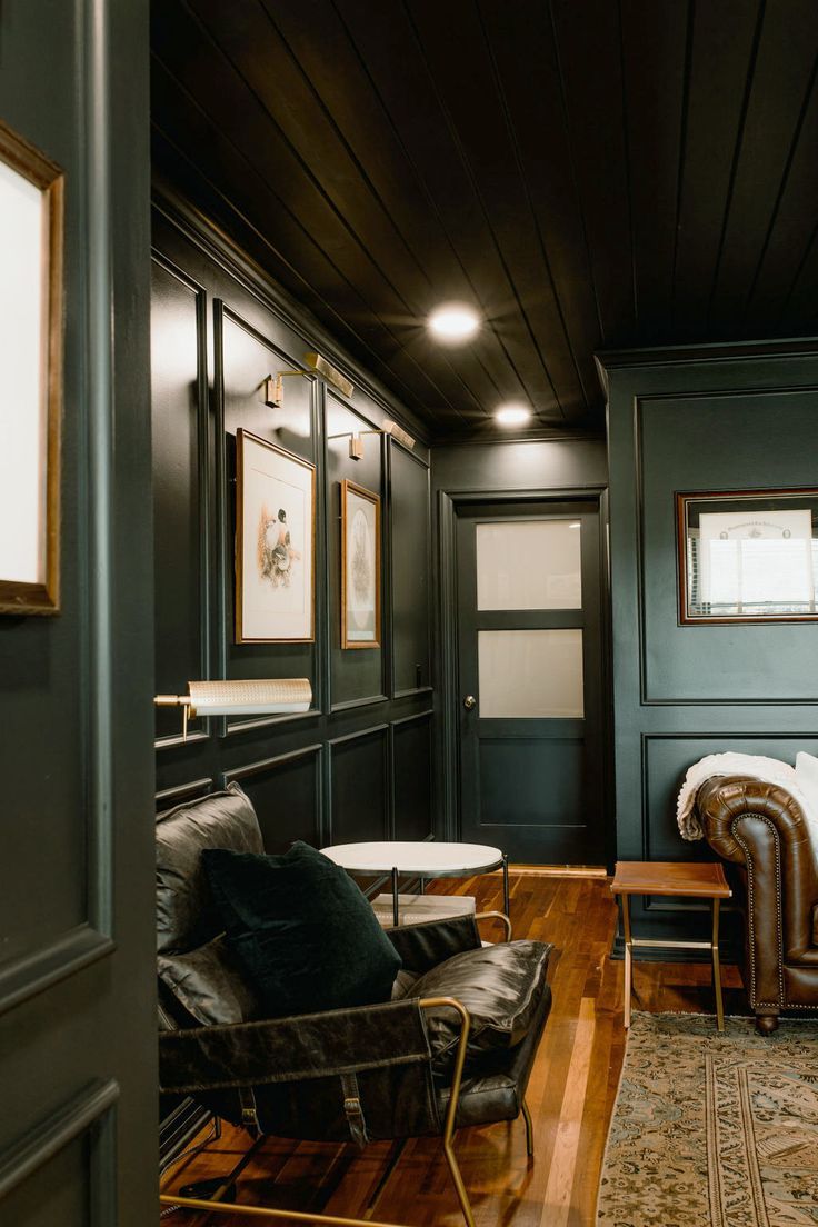 a living room filled with furniture and wooden floors