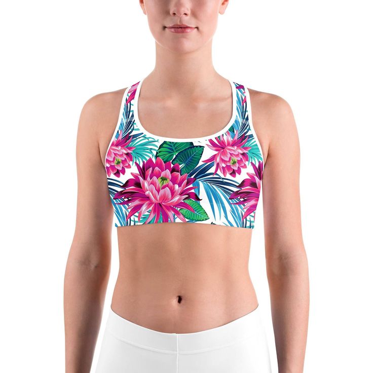 This gorgeous sports bra is made from moisture-wicking material that stays dry during low and medium intensity workouts. The bra has support material in the shoulder straps, double layer front, and a wide elastic band to ensure constant support. White Sports Bra, Black Sports Bra, Intense Workout, Tropical Flowers, Moisture Wicking Fabric, Elastic Band, Shoulder Straps, Double Layer, Moisture Wicking