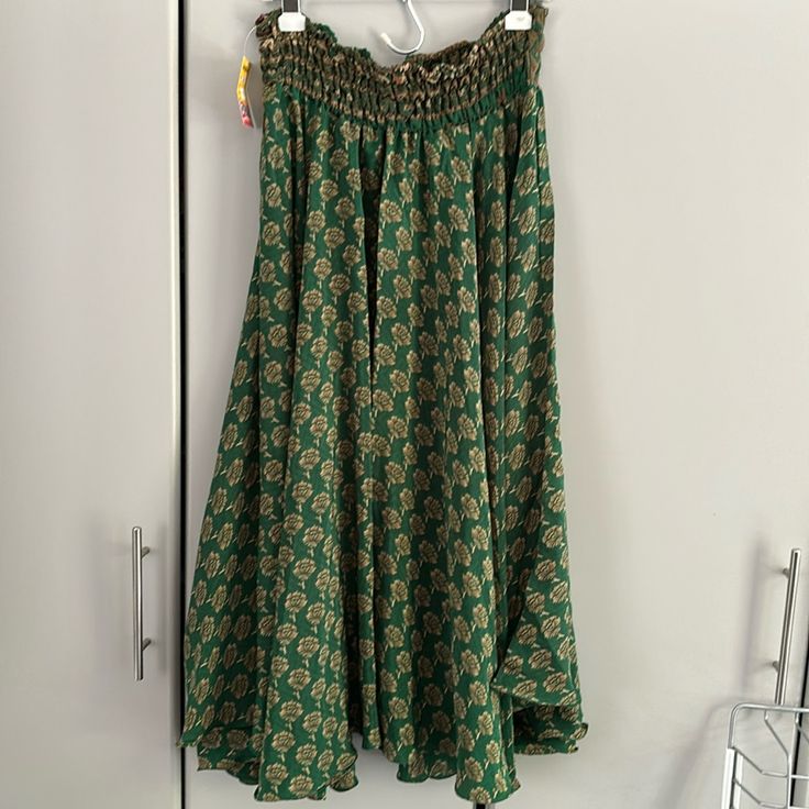 New With Tags Bohemian Skirt, Emerald Green With Gold/Brown Flowers. 80% Silk And 20% Rayon Green Bohemian Maxi Skirt With Boho Print, Green Bohemian Maxi Skirt For Festival, Bohemian Green Maxi Skirt For Festivals, Flowy Long Skirt With Boho Print, Flowy Boho Print Long Skirt, Boho Print Beach Skirt, Hippie Boho Print Tiered Skirt, Bohemian Rayon Skirt For Summer, Vacation Rayon Lined Skirt Bottoms