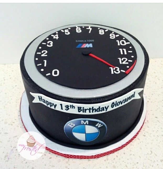 a birthday cake made to look like a bmw clock