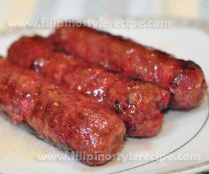 two sausages are on a plate with ketchup