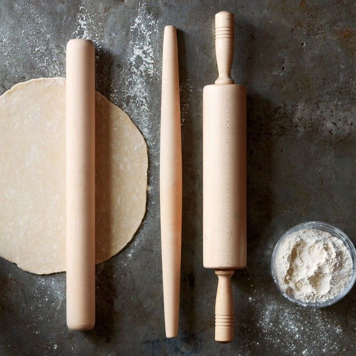 dough and rolling pin on top of a table