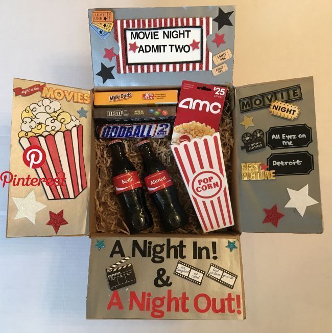 an open box with some movies and movie tickets