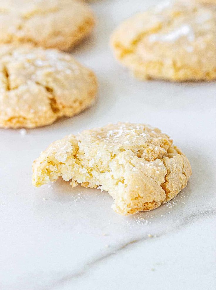 some cookies are sitting on a white surface