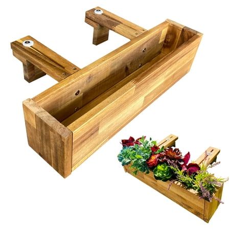 a wooden planter box with plants in it next to a small garden bed that has been made out of wood