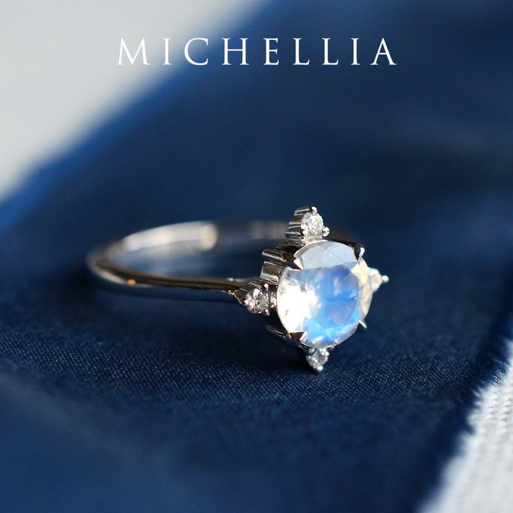 "Our current turnaround time for regular orders is 6-8 weeks. For urgent orders, please shop our Ready-to-Ship collection below (7-10 business days): https://michellia.com/collections/ready-to-ship (please copy and paste into browser) -------- 「Polaris」- North Star Ring, in Moonstone | R3008 As the brightest star in the constellation Ursa Minor, the Polaris is known for holding nearly still while the entire northern sky moves around it, always steady, trustworthy, and reassuring even when the da White Celestial Moonstone Ring In 14k Gold, White Moonstone Celestial Ring In 14k Gold, Celestial Style Moonstone Ring With Accent Stones, Celestial Moonstone Ring With Accent Stones, Heirloom White Gold Diamond Moonstone Ring, Heirloom Moonstone Ring In White Gold With Diamonds, Celestial 14k Gold Moonstone Wedding Ring, Celestial Style 14k Gold Moonstone Wedding Ring, Celestial Style Moonstone Wedding Ring In 14k Gold