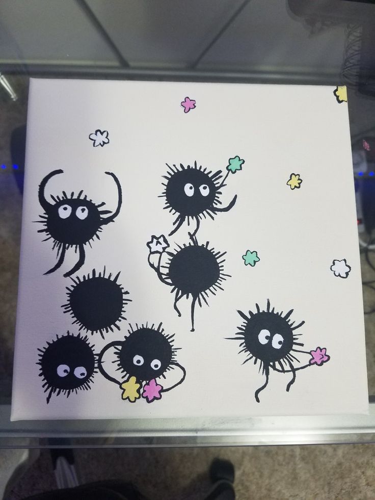 an image of some black and white stickers on the wall in front of a glass case