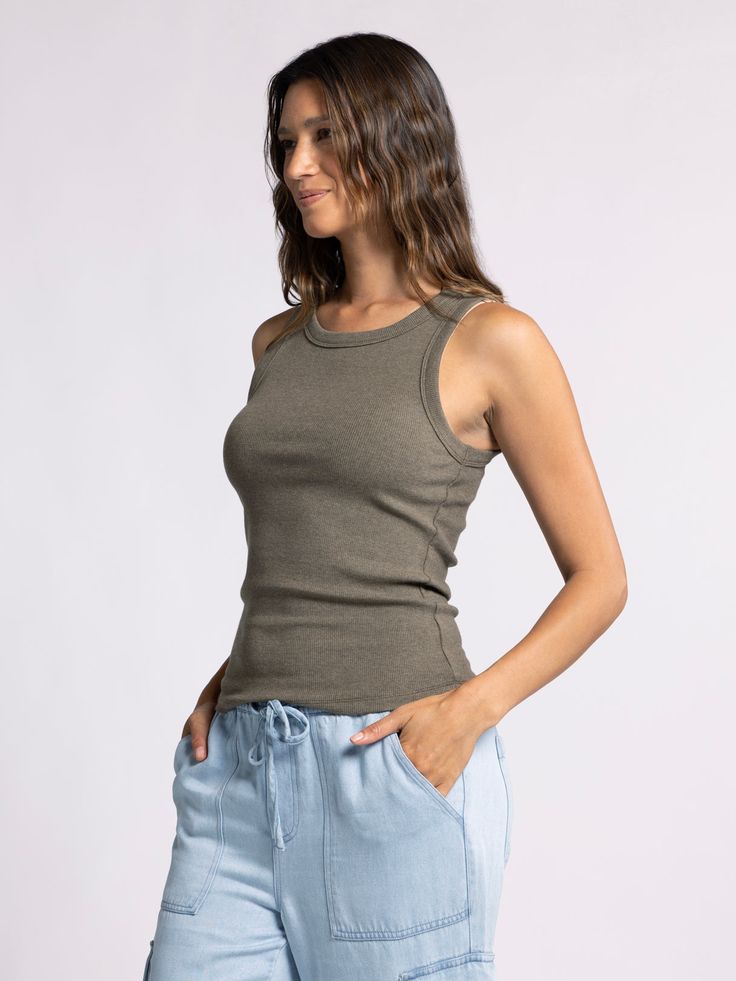 Style Description: Forever timeless in the EDLIN TANK! Crafted in a soft ribbed fabrication, this tank is a wear-everywhere kind of essential. Sleeveless tank Crew neckline Measurements for a size small: Length: 23" Chest: 14" Waist: 13" Fabric Content/Care: 48% Cotton 48% Modal 4% Spandex Machine Wash ColdImport Everyday Ribbed Tank Top, Casual Racerback Camisole For Loungewear, Casual Solid Seamless Tank Top, Casual Seamless Solid Tank Top, Casual Seamless Solid Color Tank Top, Ribbed Tank Top For Layering, Casual Seamless Camisole For Everyday, Casual Everyday Seamless Camisole, Spring Everyday Ribbed Camisole