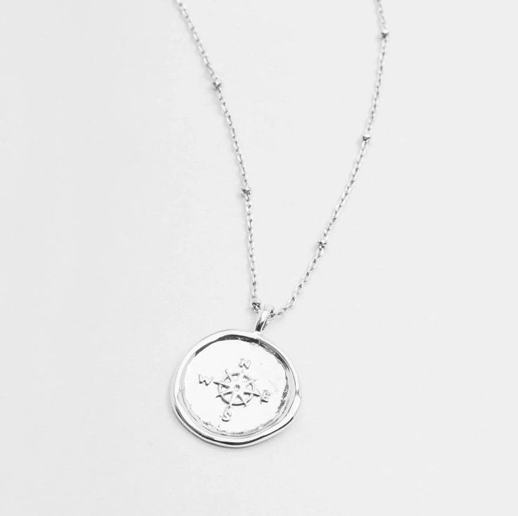 Gorjana's design with the aesthetic of a found object, this unique coin necklace has the feel of a family heirloom. This coin charm centers on an ever-so-dainty ball chain that effortlessly elevates your layered look. Chain extends out to 19" Coin is 3/4" across Spring ring closure Silver plated brass Lifetime manufacturer's warranty Avoid contact with anything containing derivatives of alcohol Coin Necklace Silver, Gorjana Necklace, Gorjana Jewelry, Silver Coin Necklace, Gold Coin Necklace, Family Heirloom, Coin Necklace, Found Object, Brass Material