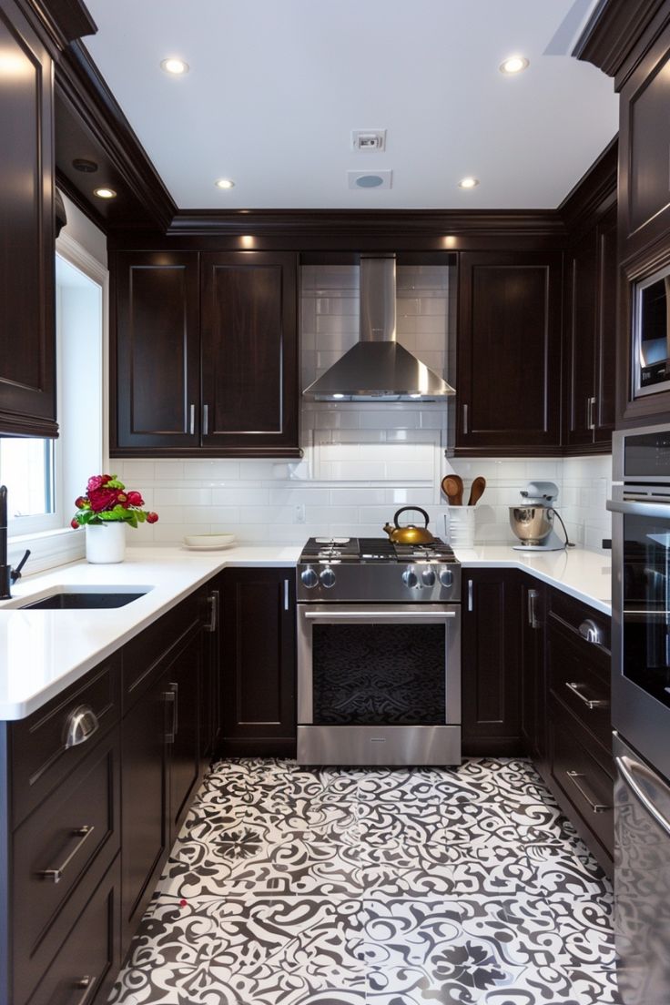 a kitchen with black and white tile flooring next to dark wood cabinets, stainless steel appliances and an oven