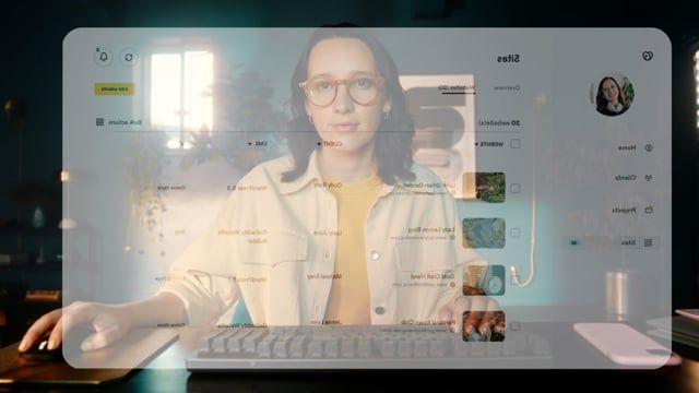 a woman with glasses is on a computer screen