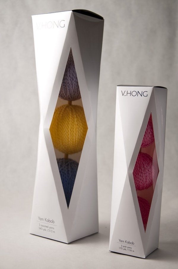 the packaging is designed to look like an origami box with three balls of yarn in it