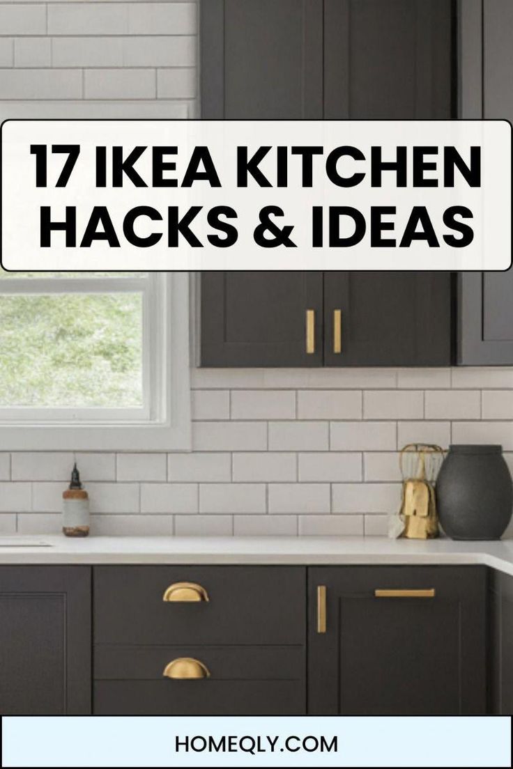 a kitchen with gray cabinets and white tile backsplash, gold pulls on the cabinet doors