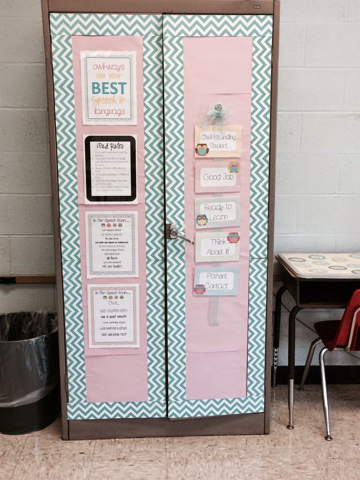 a pink and blue refrigerator sitting next to a table