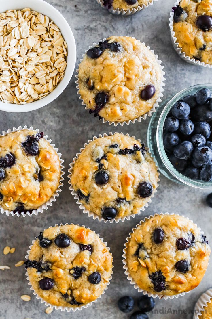 blueberry oatmeal muffins with fresh blueberries in the background