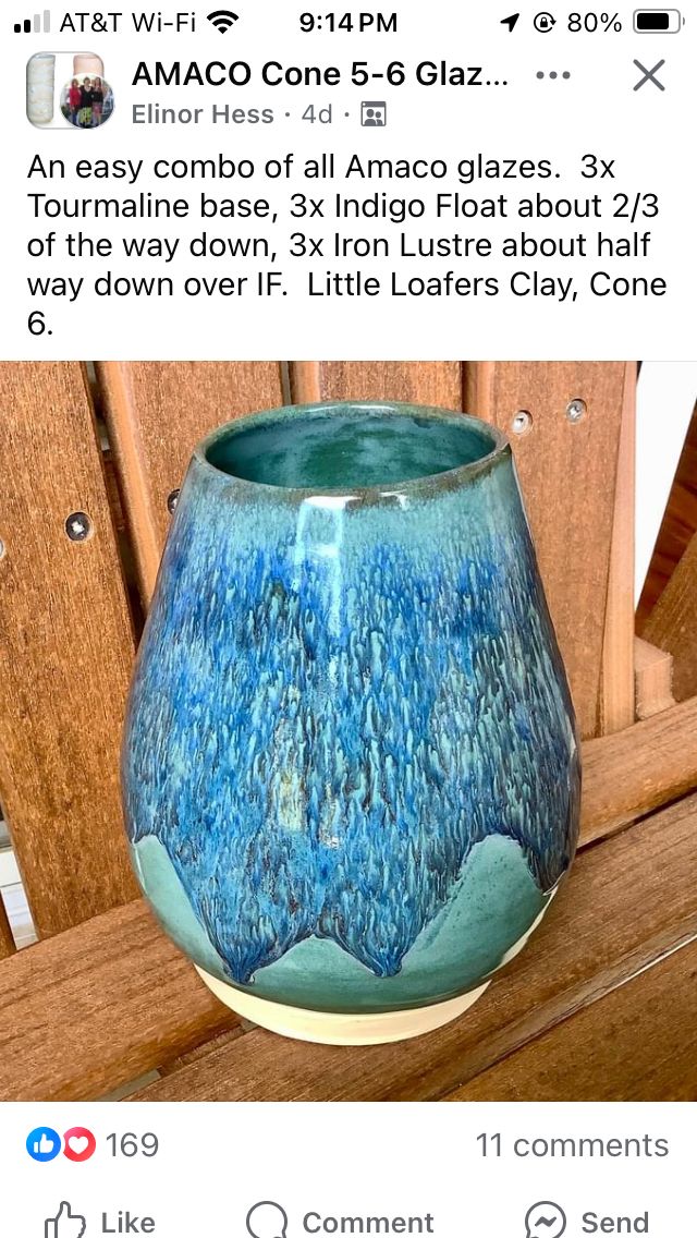 a blue vase sitting on top of a wooden chair