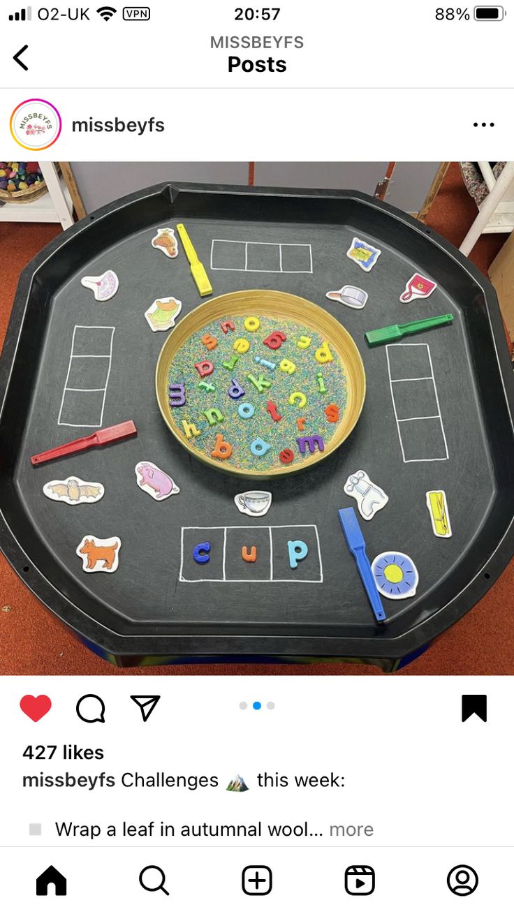 a black tray with writing and pictures on it