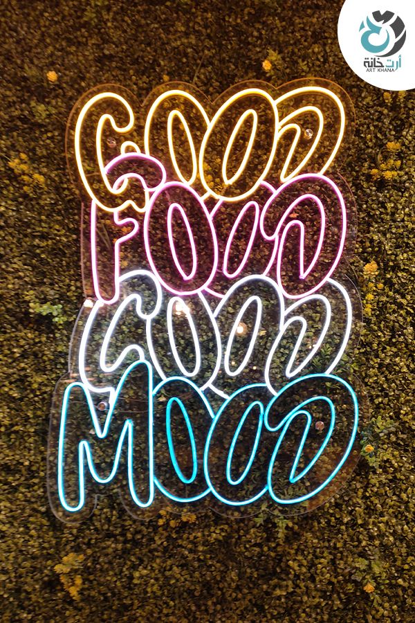 neon stickers that say good to the moon and have been placed on the ground