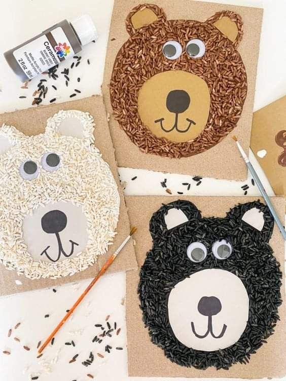 three bear and bear faces made out of brown paper on top of crafting supplies