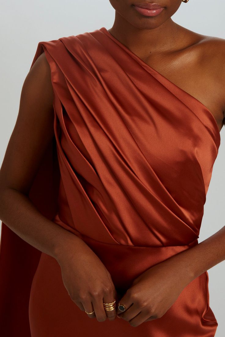 Fluid satin fit-to-flare gown bias draped one-shoulder dress. Shown in Copper. Draped One Shoulder Dress, African Evening Dresses, Satin Colors, Amsale Dress, Copper Dress, Satin Fashion, Fashion Drawings, Flare Gown, Drape Dress