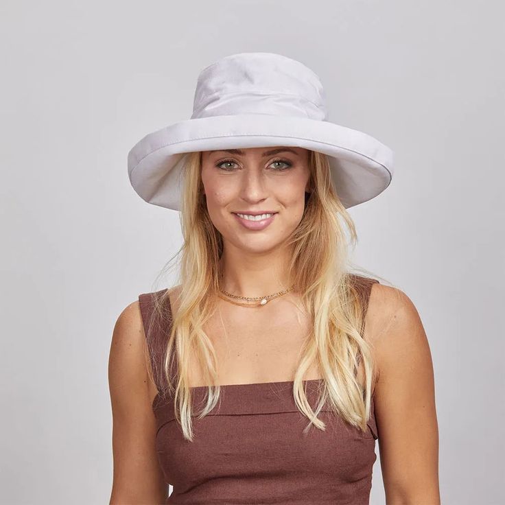 Sunny | Womens Cotton Sun Bucket Hat offers lightweight sun protection with a casual, relaxed feel. The wide 5" brim and soft cotton construction make it perfect for women who want comfort and style during sunny outings. Material: 100% Cotton Shape: Sun Hat Trim: Unbanded Brim Size: 5" Crown Height: 4" Sweatband: Inner Drawstring Imported Solid Flat Brim Sun Hat With Uv Protection, Solid Sun Hat With Uv Protection And Flat Brim, Solid Sun Hat With Uv Protection And Curved Brim, Sun Hat With Uv Protection And Flat Brim, Flat Brim Panama Hat With Upf 50+, Solid Flat Brim Hat With Uv Protection, Panama Hat With Upf 50+ And Flat Brim, Brimmed Sun Hat With Uv Protection For Kentucky Derby, One Size Flat Brim Bucket Hat With Uv Protection