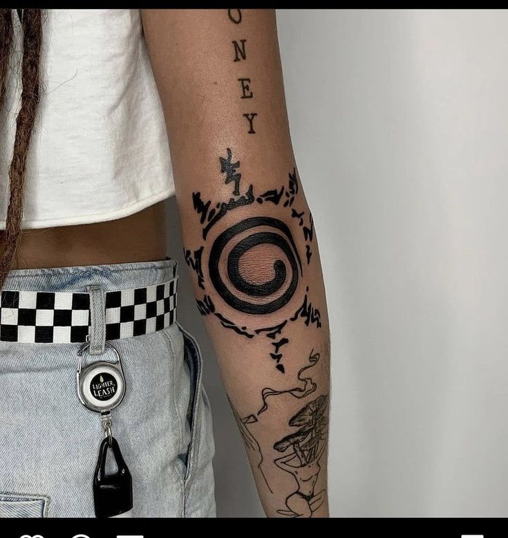 a woman with a tattoo on her arm and the words money are written in black ink