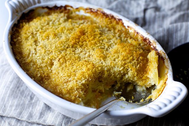 a casserole dish with a spoon in it